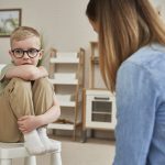 Little boy talking with the therapist